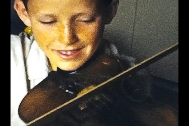 Lee Van Schaack Plays the Violin for His Family