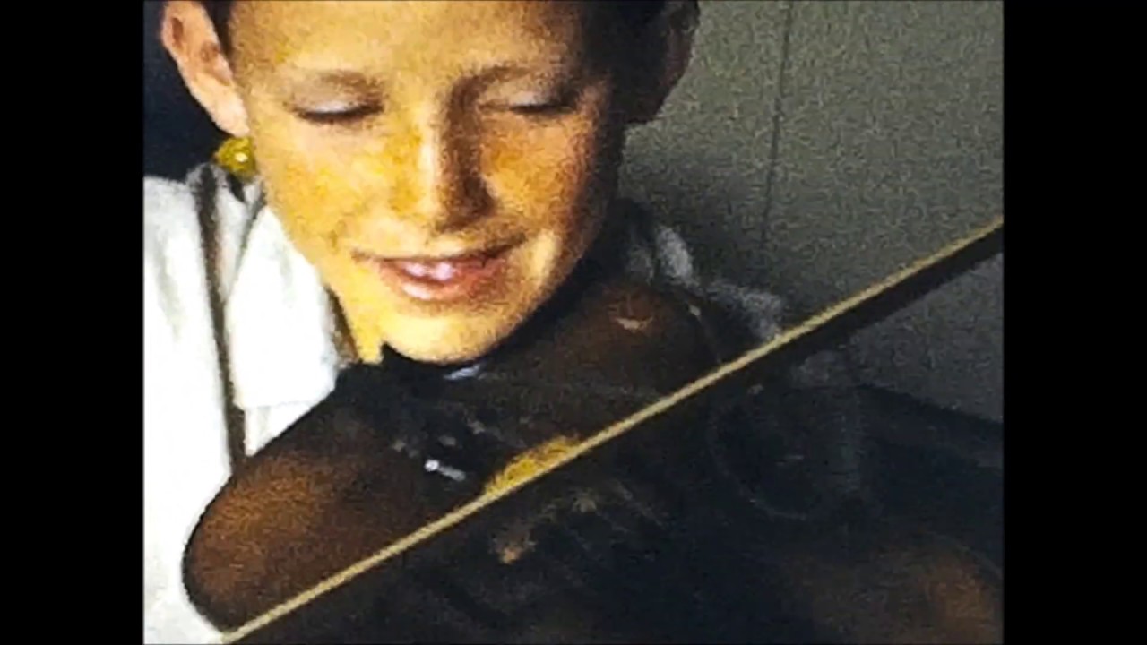 Lee Van Schaack Plays the Violin for His Family